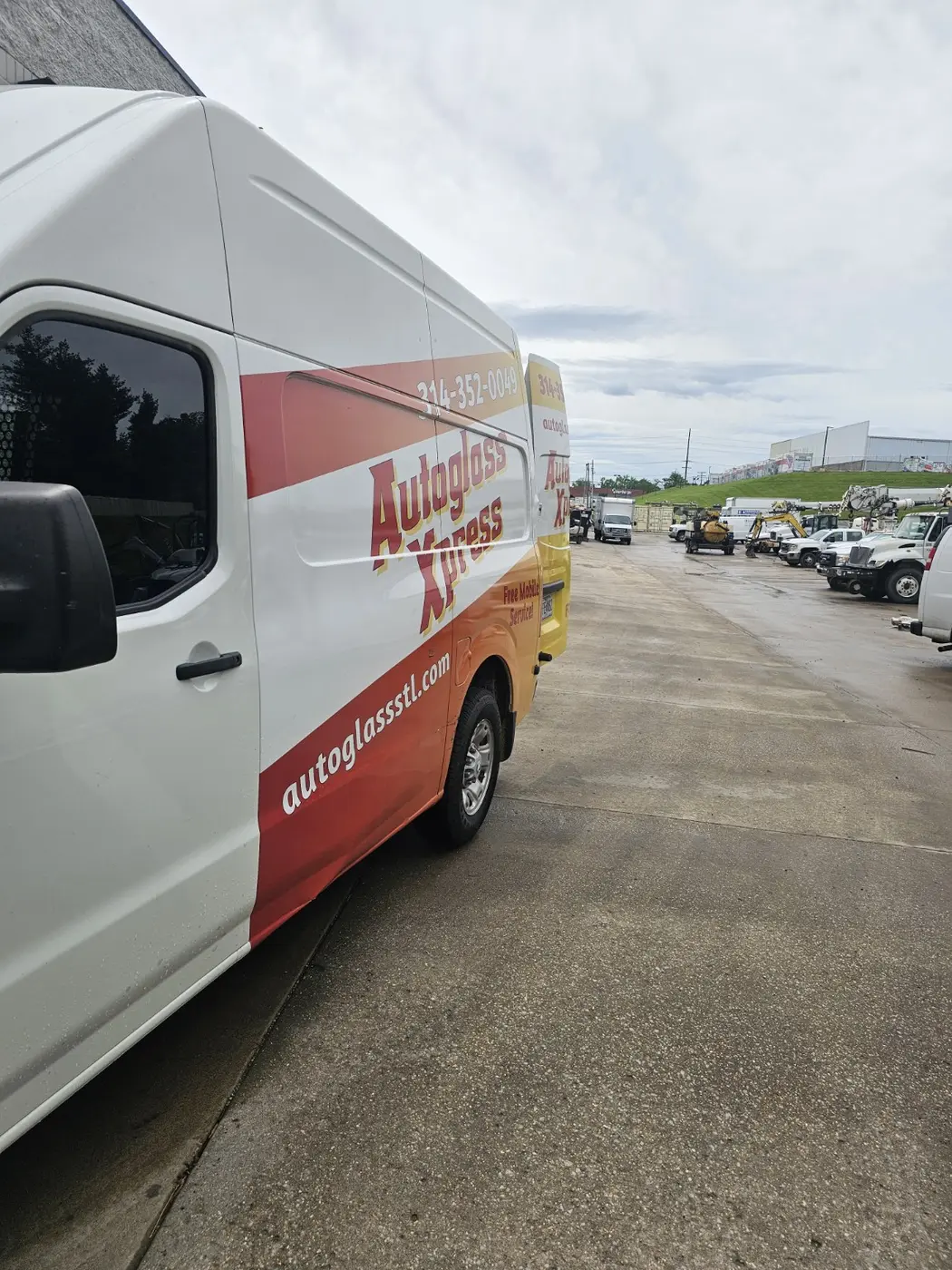 Auto Glass Xpress mobile fleet service at a St. Louis commercial vehicle yard