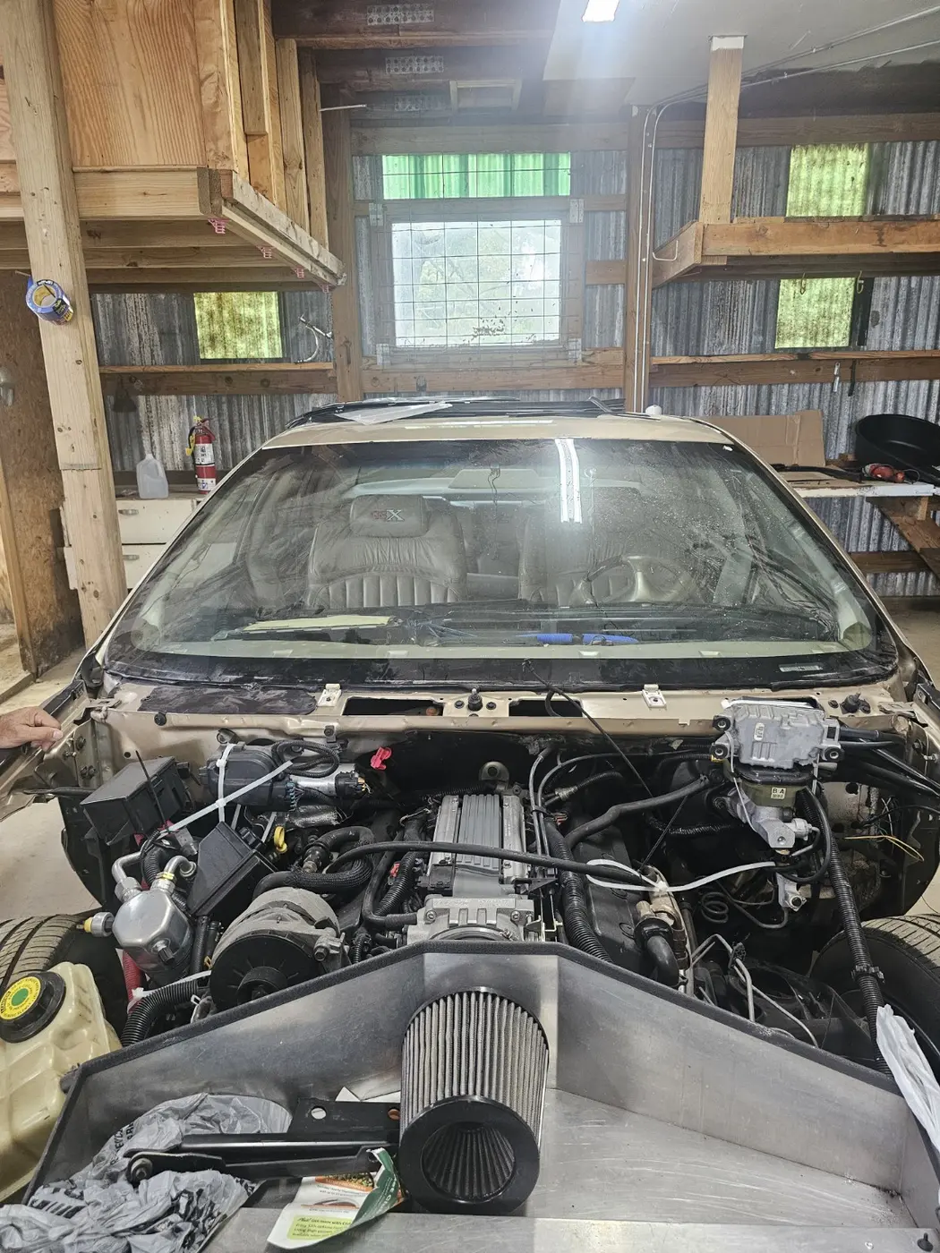 Windshield replacement work performed in a St. Louis body-shop service area